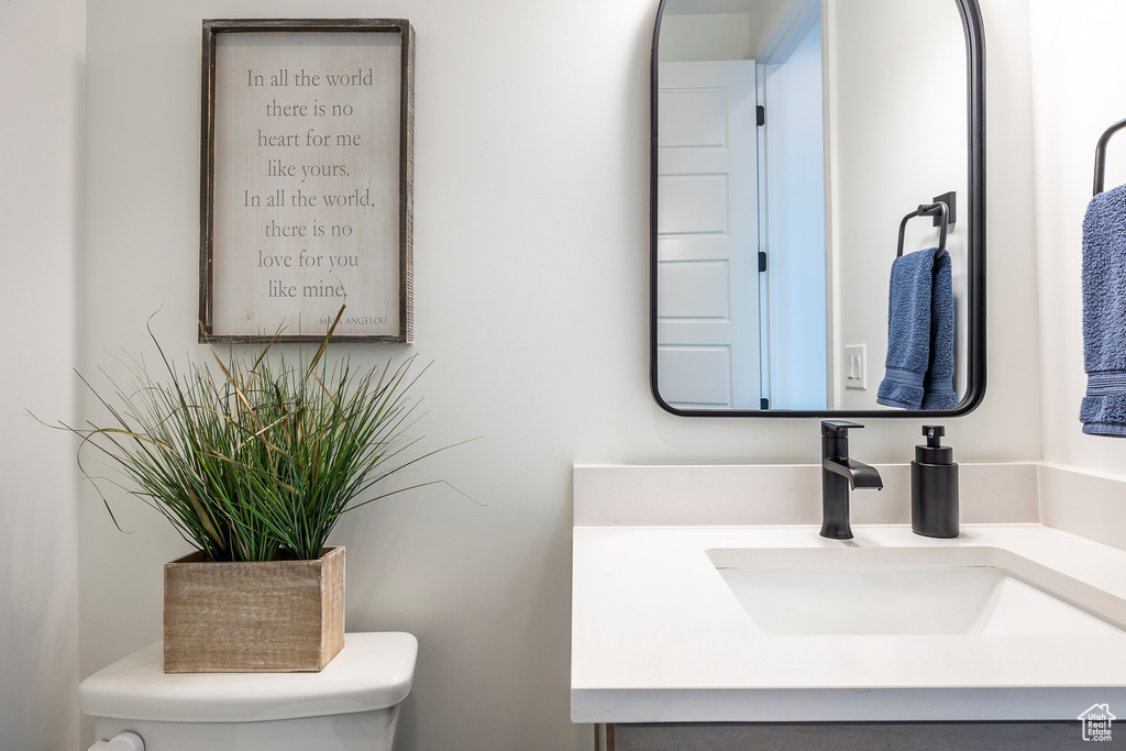 Bathroom featuring toilet and vanity