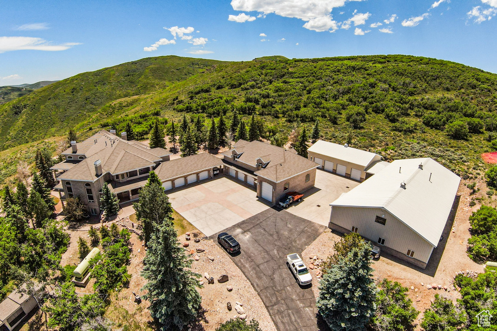 Birds eye view of property with a mountain view