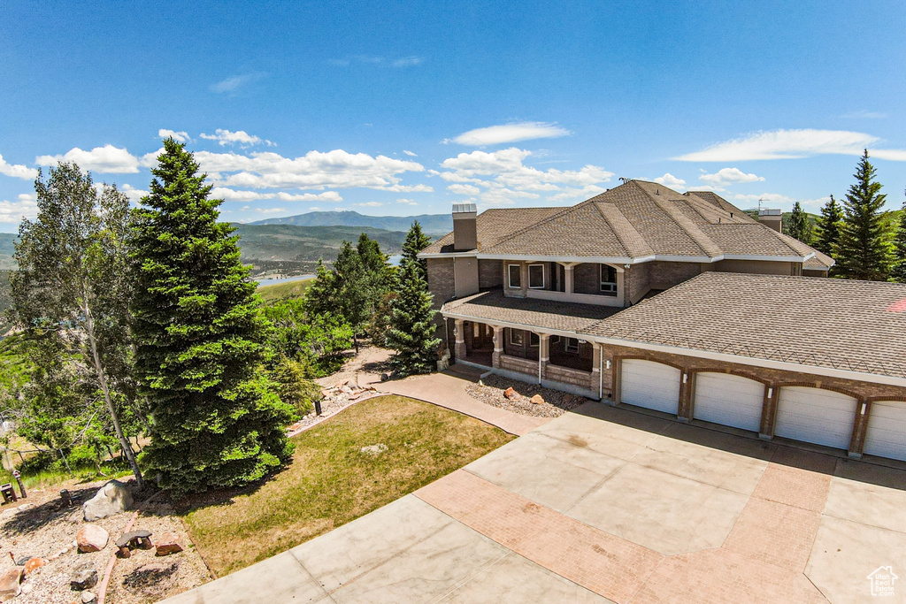 Exterior space with a garage and a mountain view