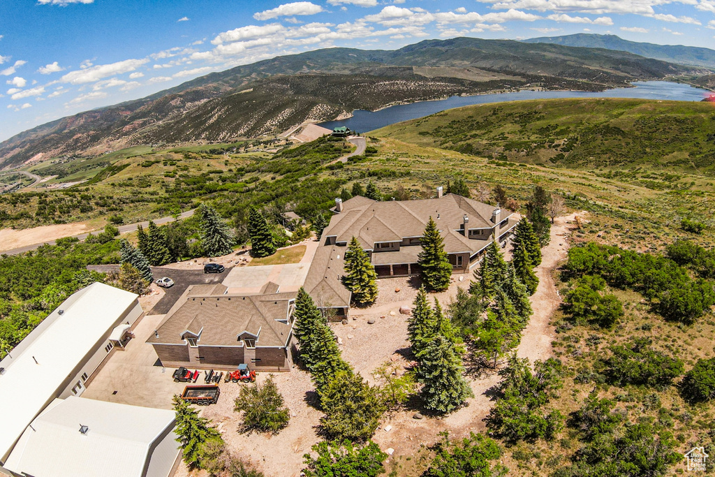 Drone / aerial view with a water and mountain view