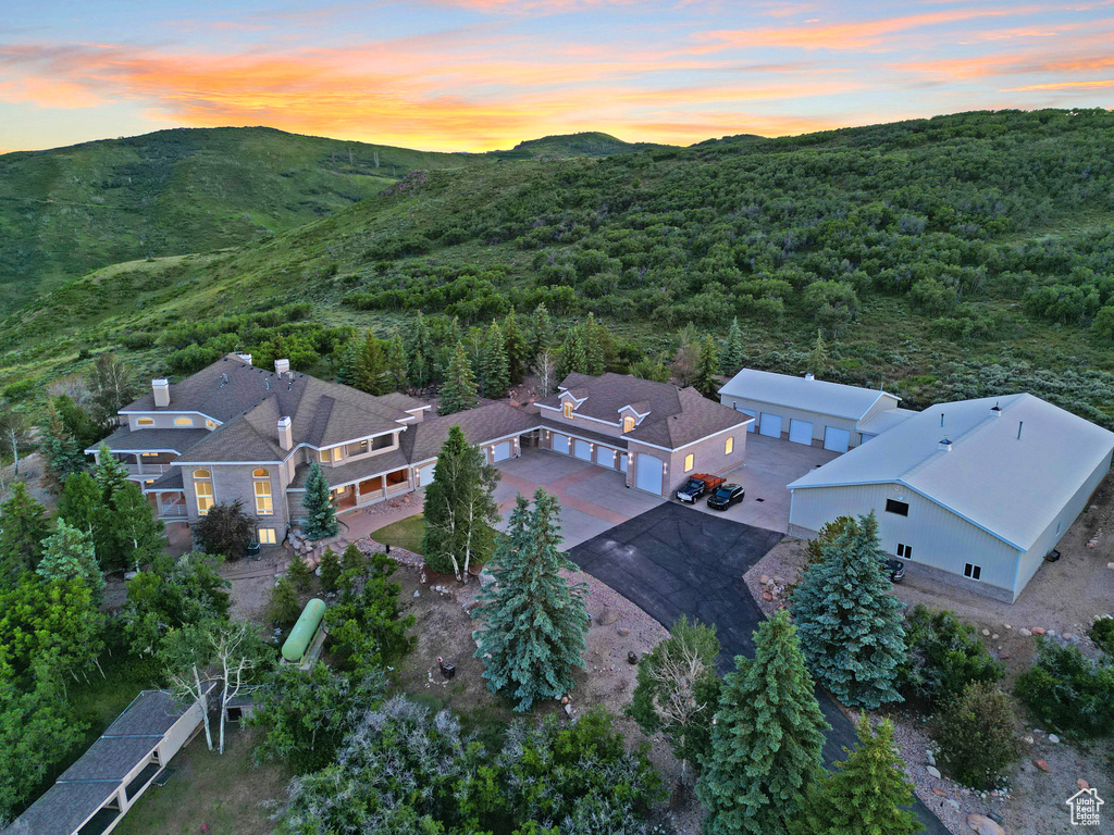 Aerial view at dusk featuring a mountain view