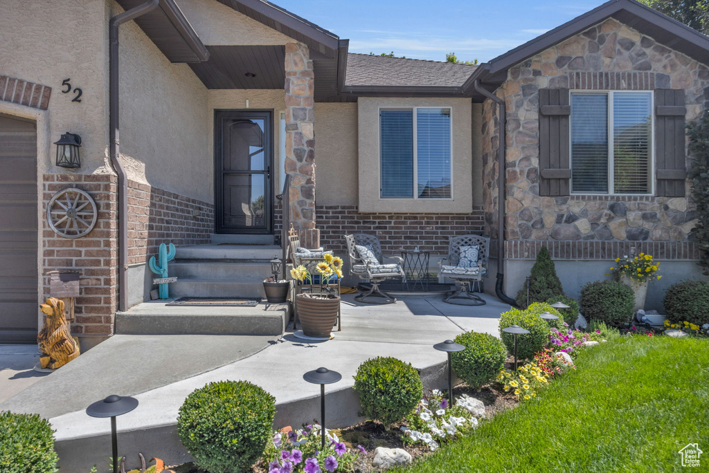 Entrance to property with a patio area