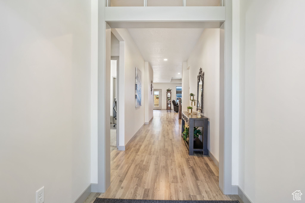 Corridor with light wood-type flooring