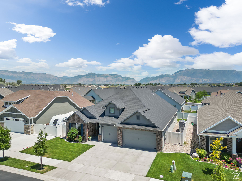 View of front of home featuring a garage and a mountain view