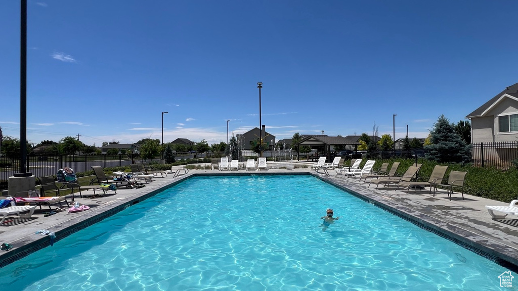 View of swimming pool with a patio area