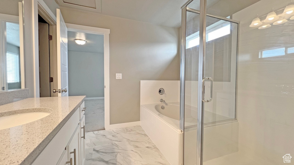 Bathroom with tile floors, plus walk in shower, and vanity