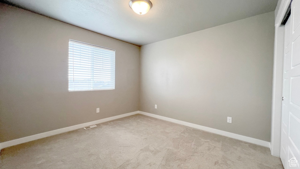 Unfurnished bedroom featuring carpet flooring