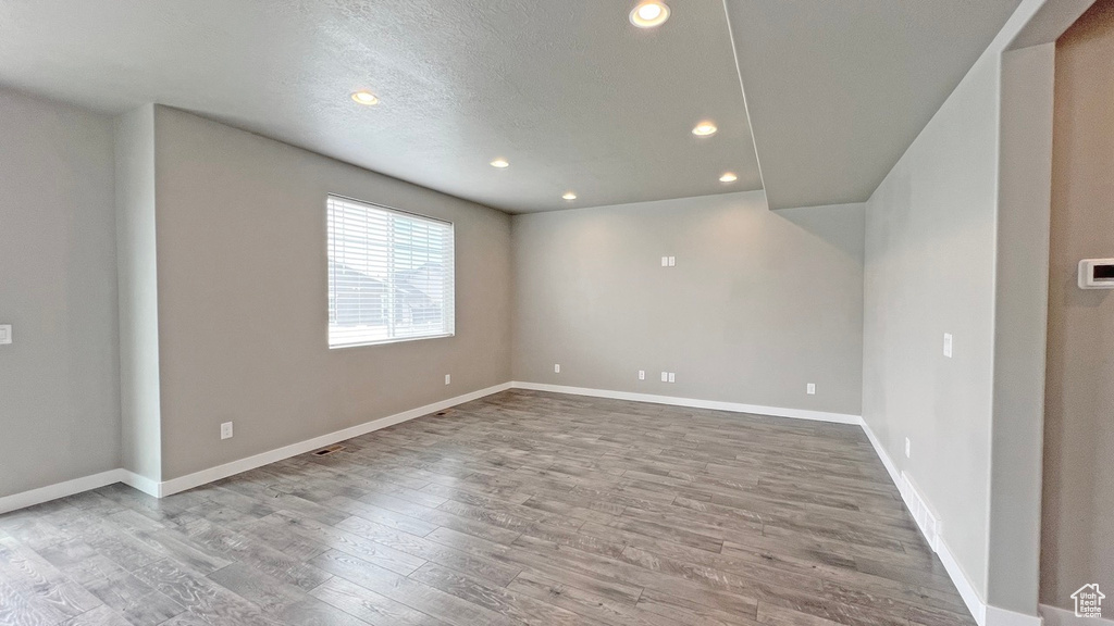 Unfurnished room featuring hardwood / wood-style flooring