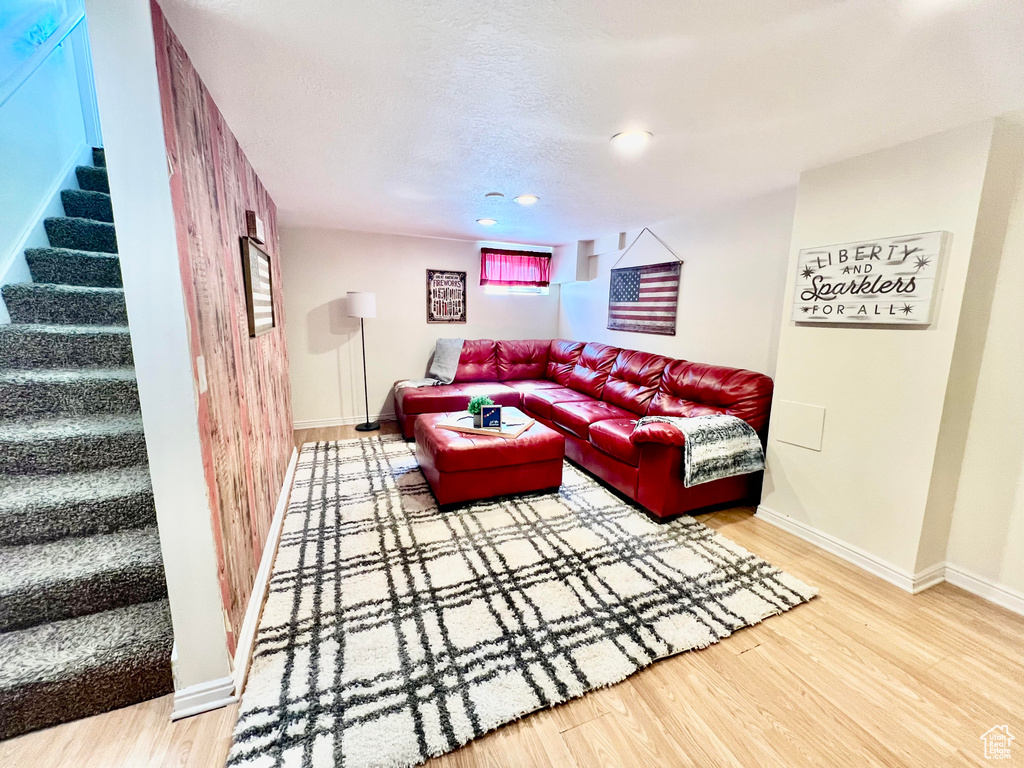 Living room with hardwood / wood-style flooring