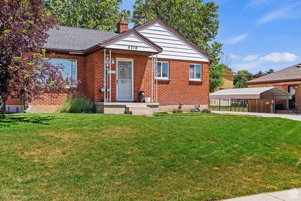 View of front of house with a front yard