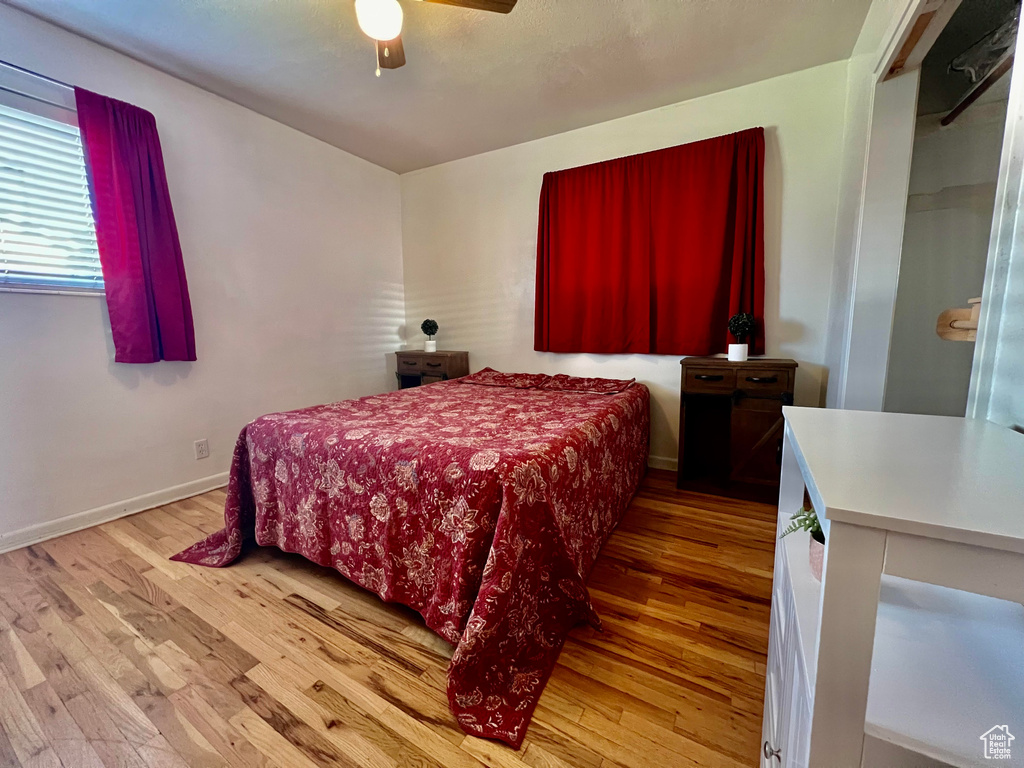 Bedroom featuring light wood-type flooring and ceiling fan