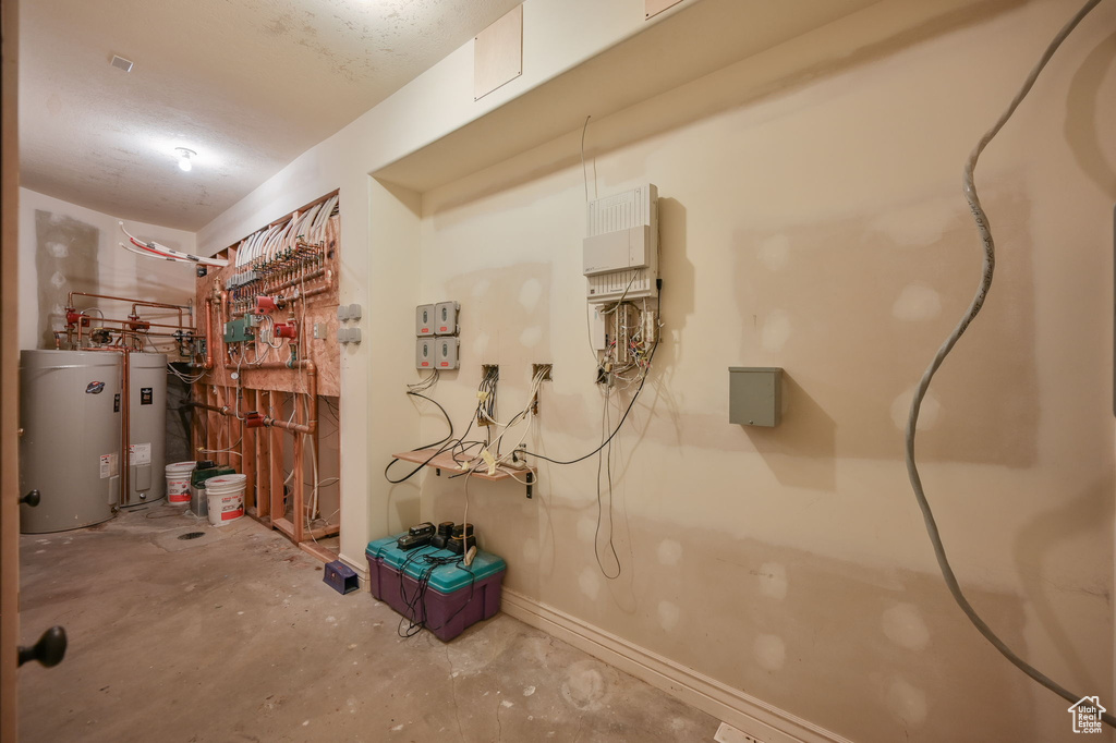 Basement featuring electric water heater