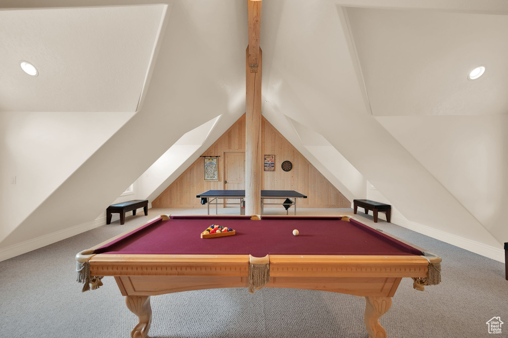 Game room with billiards, wood walls, lofted ceiling, and carpet