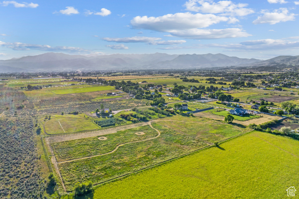 Birds eye view of property with a mountain view and a rural view