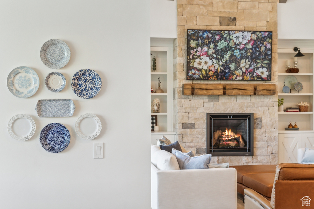 Living room with a fireplace and built in shelves