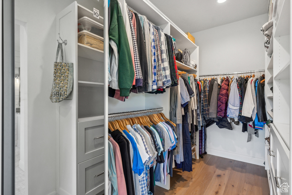 Walk in closet featuring wood-type flooring