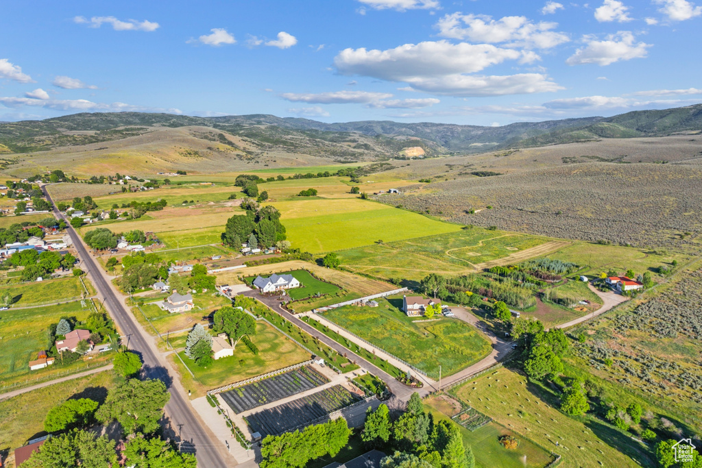 Aerial view featuring a rural view and a mountain view