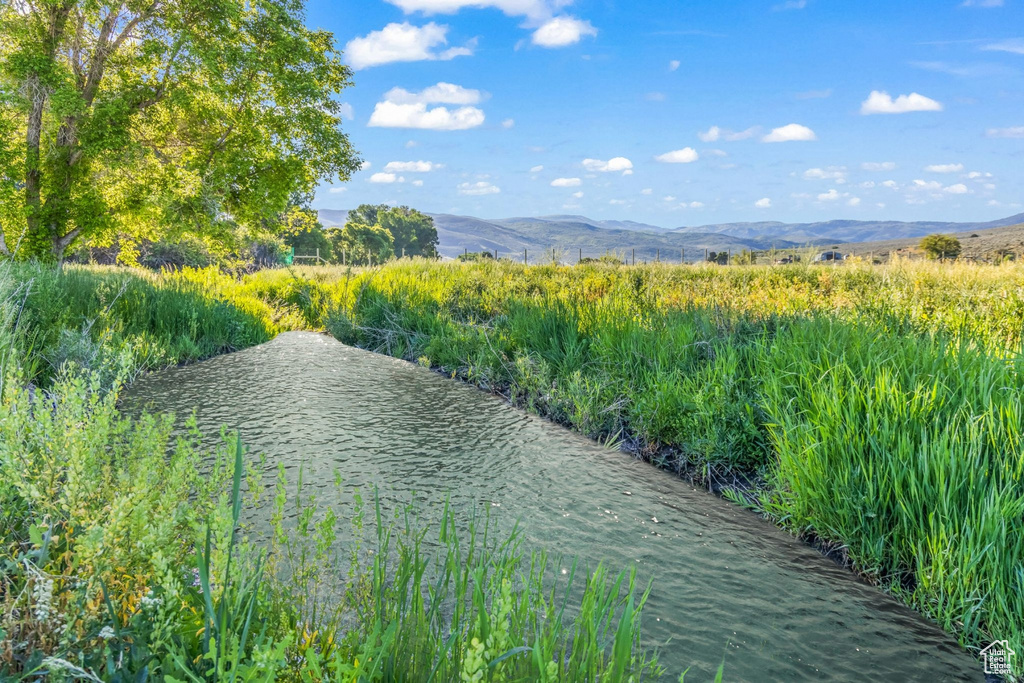 Property view of water with a mountain view