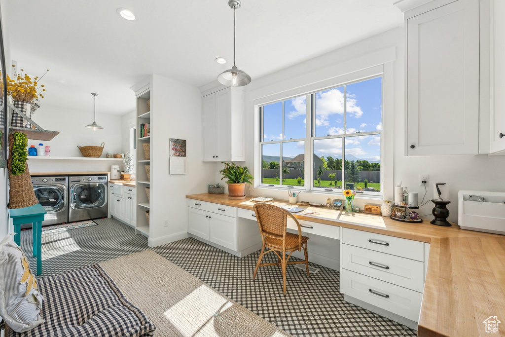 Office with washer and clothes dryer and light hardwood / wood-style flooring