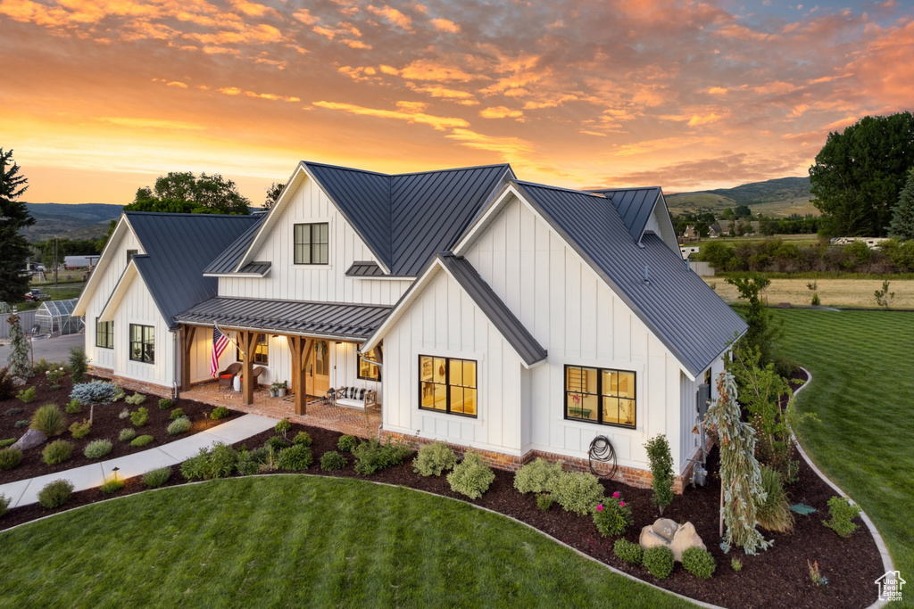 Modern inspired farmhouse with a yard