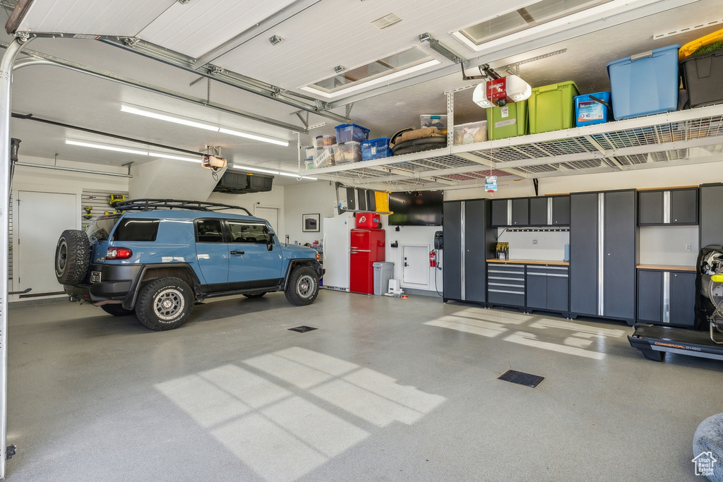 Garage featuring a garage door opener