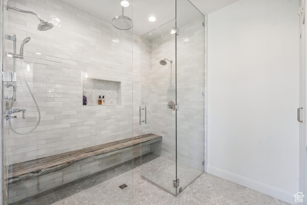 Bathroom featuring a shower with door