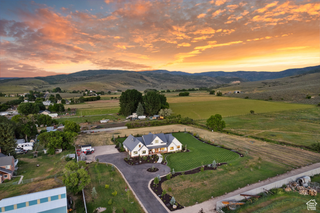 Aerial view at dusk with a mountain view and a rural view