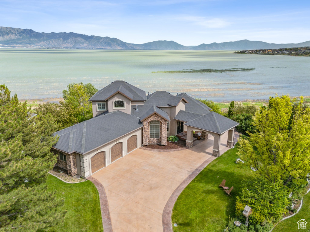 Drone / aerial view with a water and mountain view