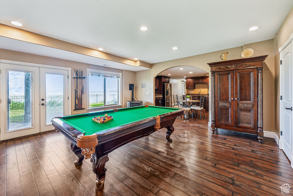 Rec room with plenty of natural light, dark wood-type flooring, french doors, and billiards