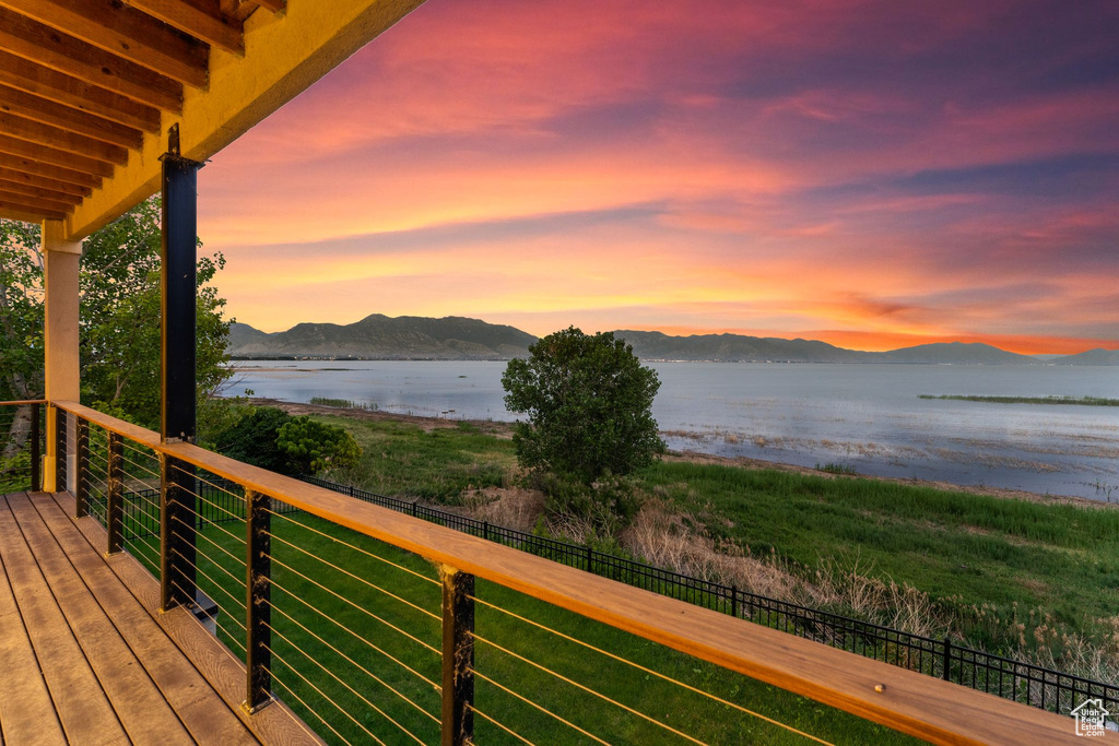 Exterior space featuring a water and mountain view