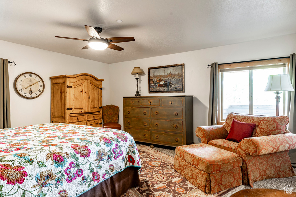 Bedroom with carpet and ceiling fan