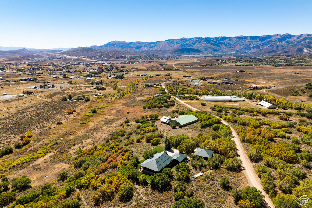 Birds eye view of property with a mountain view