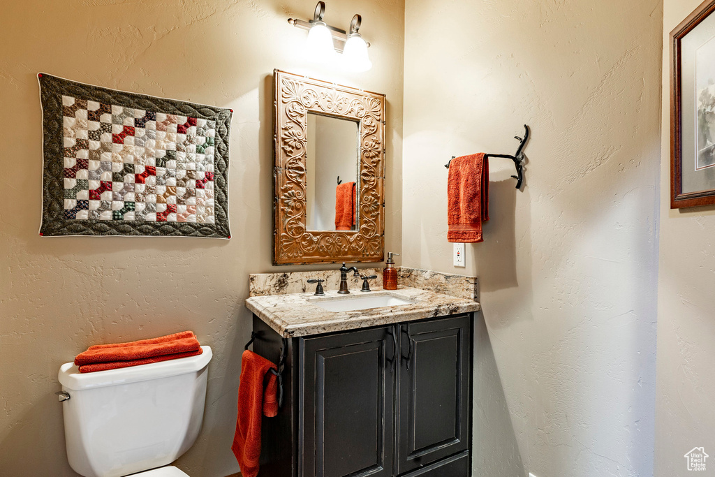 Bathroom featuring toilet and vanity