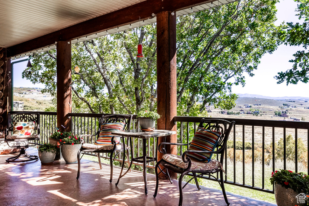 Wooden terrace featuring a mountain view