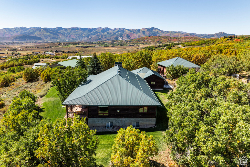 Birds eye view of property with a mountain view