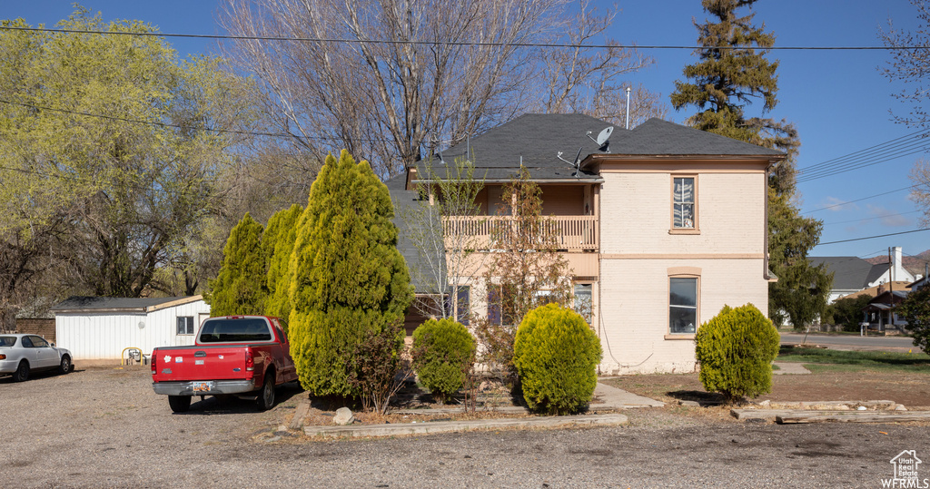 View of front of property featuring a balcony