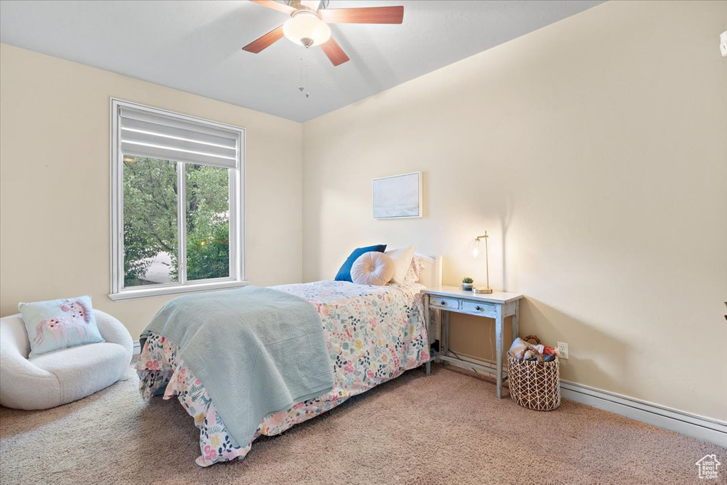 Bedroom featuring ceiling fan and carpet floors