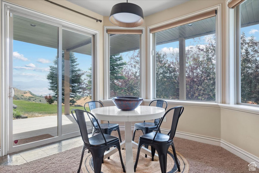 Tiled dining space with plenty of natural light