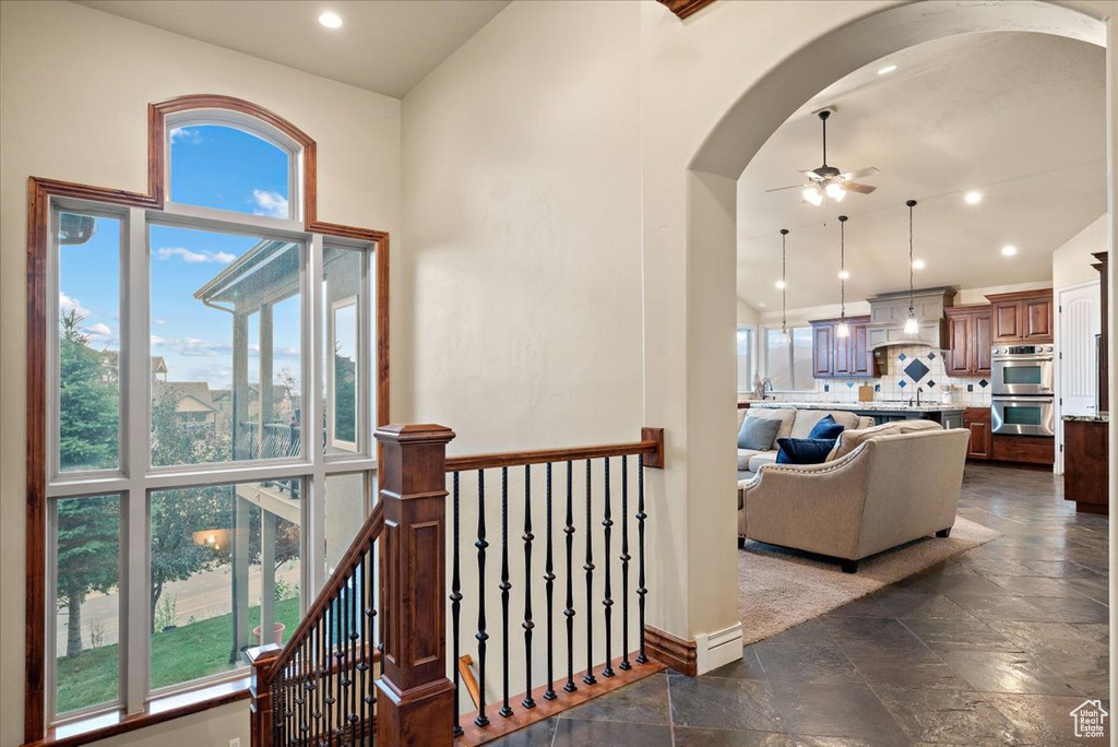 Hallway with dark tile flooring