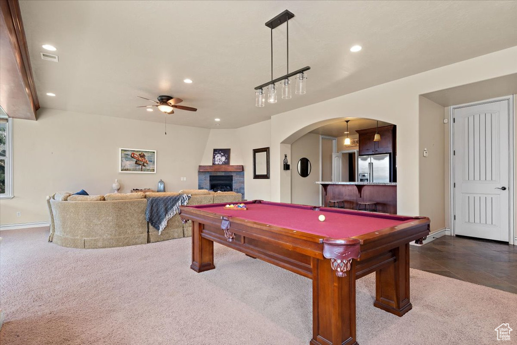 Recreation room featuring ceiling fan, dark carpet, and pool table