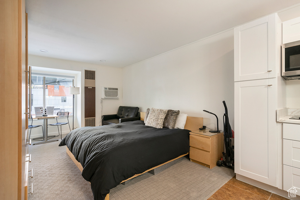 Bedroom with an AC wall unit