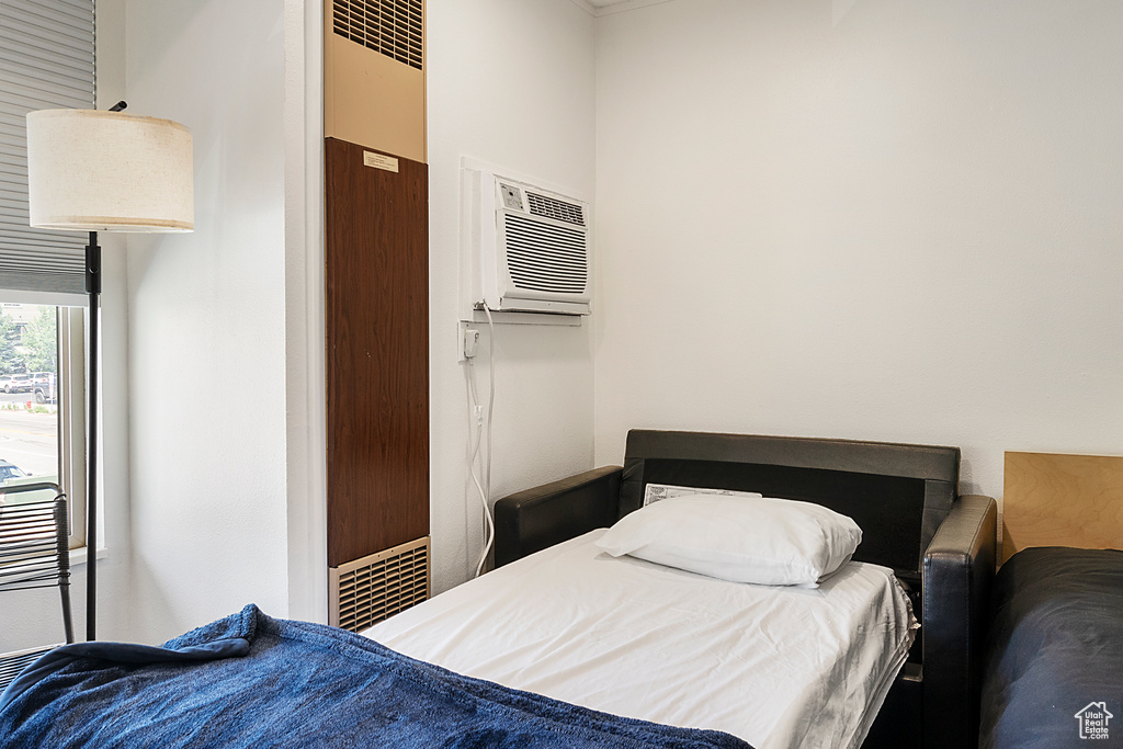 Bedroom featuring a wall mounted AC