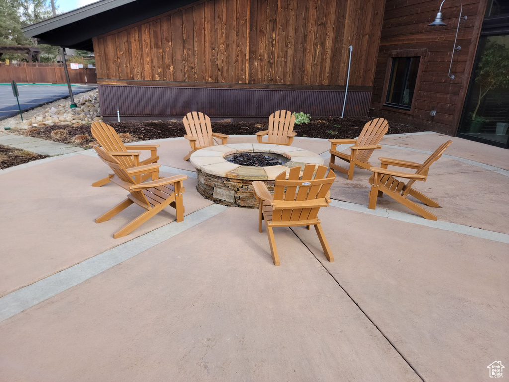 View of terrace featuring an outdoor fire pit