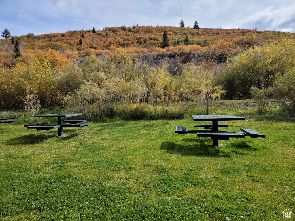 View of property\\\'s community featuring a lawn