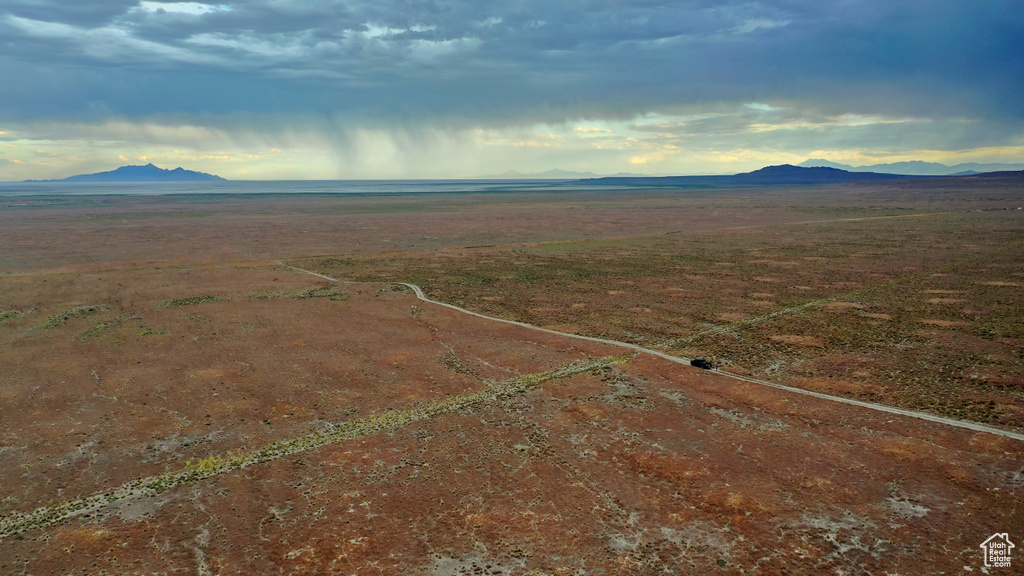 Birds eye view of property with a mountain view