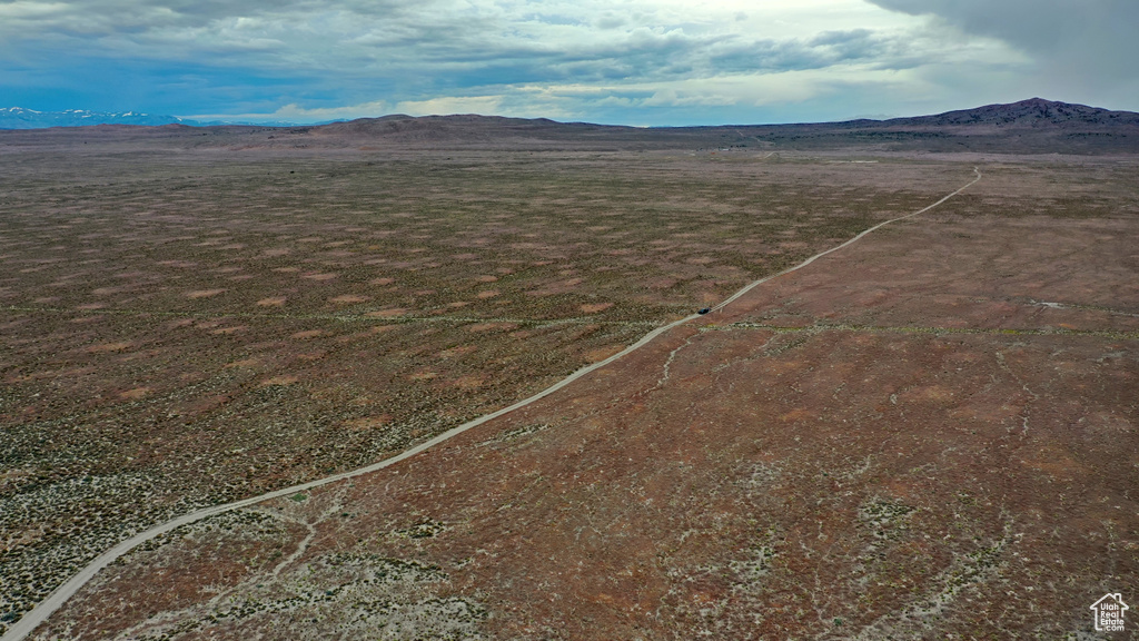 Birds eye view of property with a mountain view