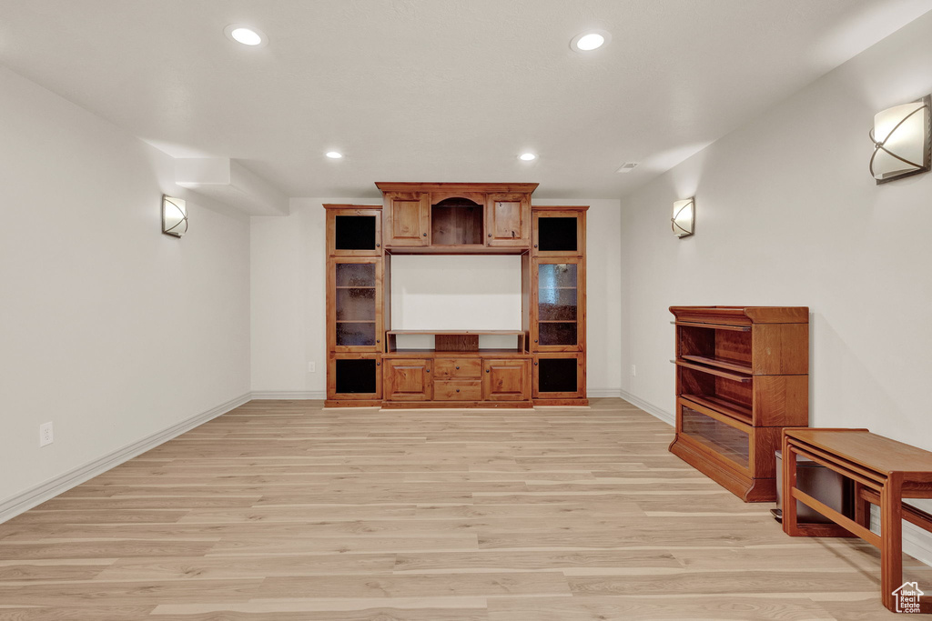 Living room with light hardwood / wood-style flooring