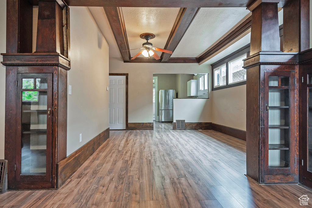 Entrance foyer with wood-type flooring and ceiling fan