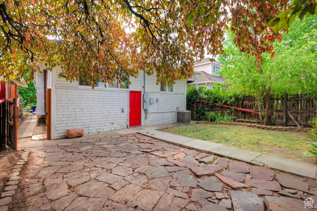 View of patio with central air condition unit