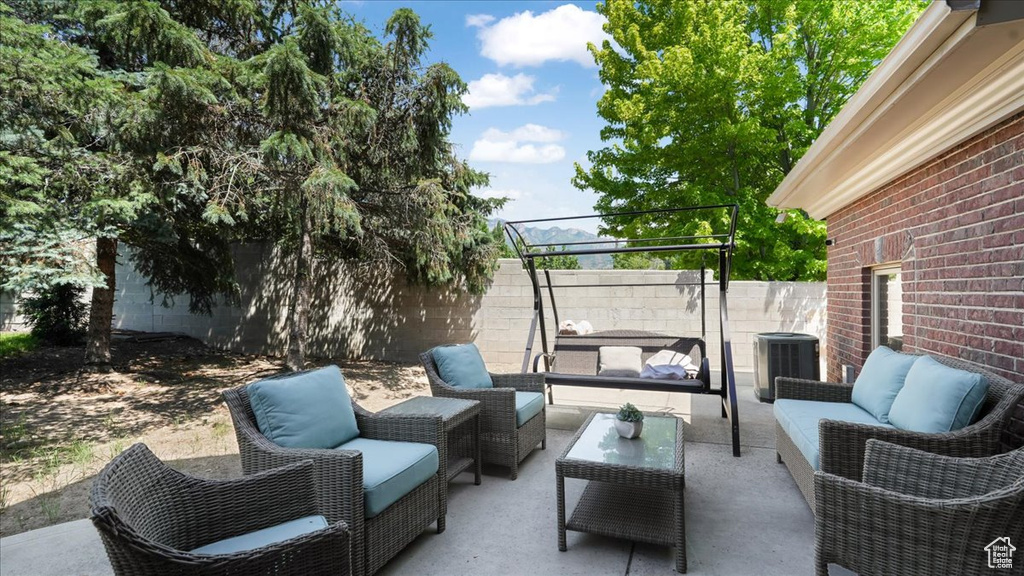 View of terrace featuring outdoor lounge area and central air condition unit